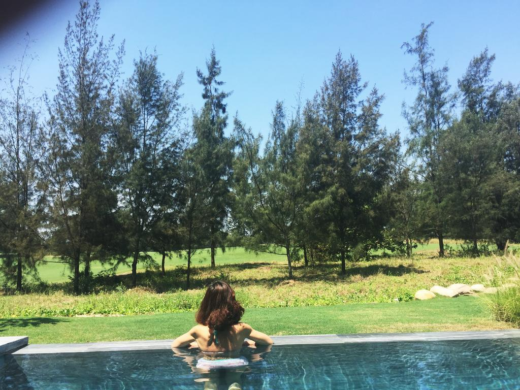 Guests enjoying the pool at The Point Da Nang Villa.